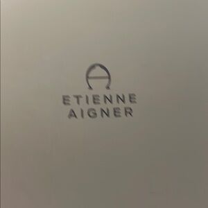 Etienne Aigner Cream Accents with Minimalist Design